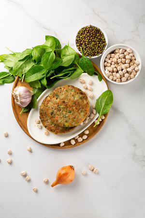 Vegan chick pea pancakes on wooden plate healthy foodの写真素材