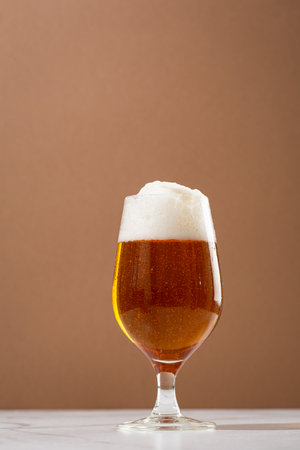 Overflowing beer foam craft alcohol background copy spaceの写真素材