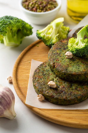 Vegan chick pea fritters on wooden plate healthy foodの写真素材