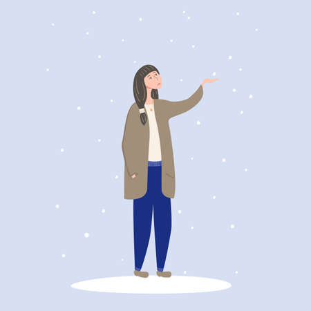 A girl walks in the winter and rejoices in the snow stretches out her hand.のイラスト素材