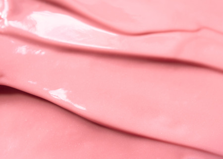 Liquid pink lipstick texture. Abstract make up backgroundの写真素材