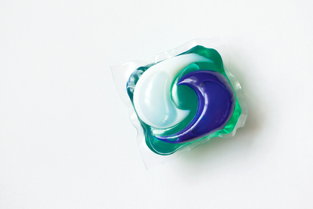 Washing capsule on white background. Concept simple washingの写真素材