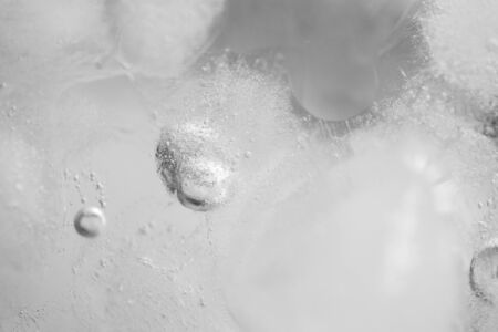 Frozen water, close-up ice texture with air bubblesの写真素材