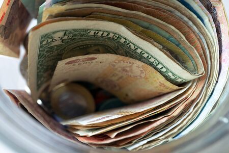 Banknotes and coins from different countries, souvenirs from travel