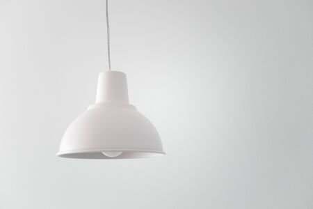 Ceiling white lamp on cable isolated on white background