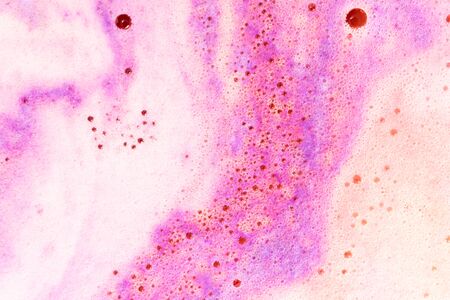Foam with round bubble of bath bomb close-up colorful backgroundの写真素材