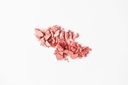 Matte delicate pink color blusher smudges on white background, close-up. Nude tone textured eyeshadow, macroの写真素材