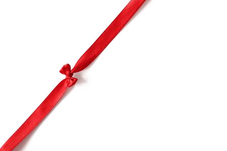 Red ribbon with tiny bow isolated on white background. Template for gift card, wedding party invite,...