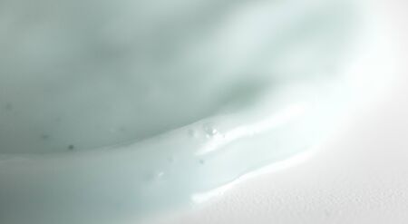 Smooth shampoo or shower gel with soft focus, close-up. Spa, beauty treatment background banner...