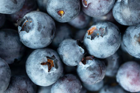 Macro ripe blueberry with selective focus texture, top view. Minimalist food background. Tasty...