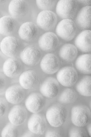 White pure vertical wallpaper. Cosmetic cotton buds texture with selective focusの写真素材