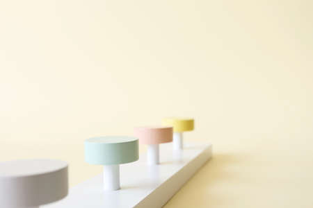 Empty podiums on yellow background with copy space, front view. Abstract minimal scene with mockup for products presentationの写真素材