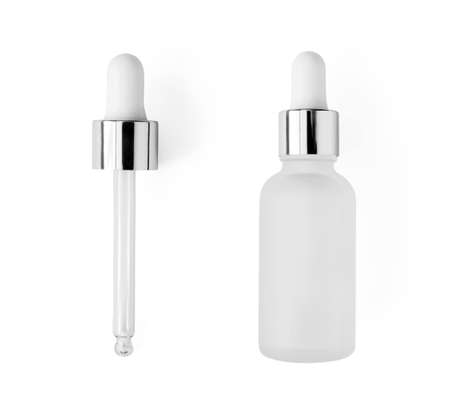 Serum bottle with pipette isolated on white background, top view. Close-up frosted glass container for skin care beauty product, above. Aromatherapy, essence or perfume blankの写真素材