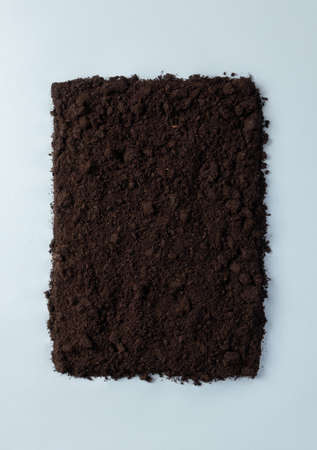 Frame from ground on blue background. Minimalistic concept compostable or biodegradable with copy...