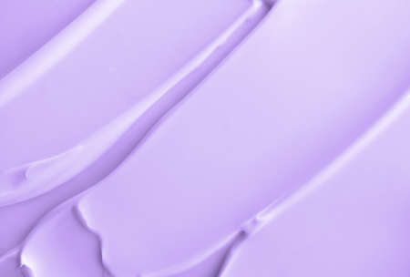 Close-up light violet cream lotion moisturiser smear smudge wavy texture. Skincare beauty product. Shampoo or hair conditioner smudgeの写真素材
