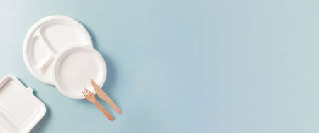 Compostable or biodegradable dinnerware flat lay composition with copy space, horizontal banner format with copy spaceの写真素材