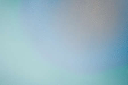 Beautiful radial rainbow gradient with mix of peach, blue and green colors and with texture of paper surface used for watercolor or aquarelle paintings. Full frame multicolored background. Copy space.の写真素材