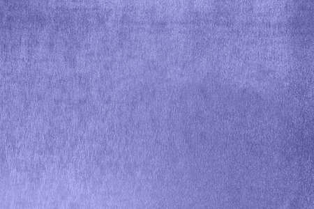 Close up of smooth surface of shiny metallic wrapping film with chameleon effect, toned in very...