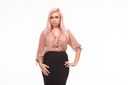Young surprised woman portrait of a confident businesswoman on a gray background. Ideal for banners, registration forms, presentation, landings, presenting concept.の写真素材