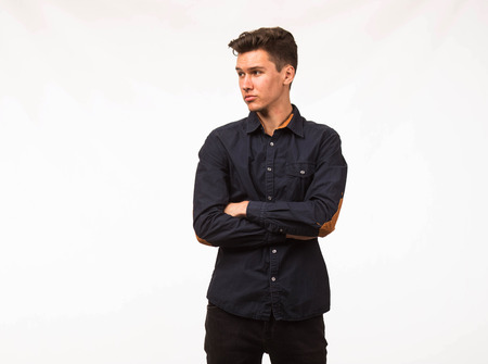 Young confident man portrait of a businessman on a gray background.の写真素材