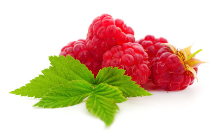 Raspberries and leaves isolated on white background.