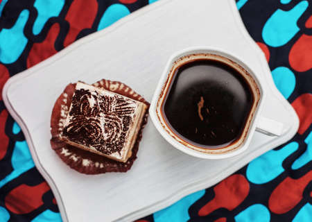 coffee and cake on the white tabletの写真素材