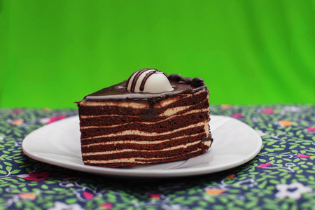 chocolate cake on a green tableclothの写真素材