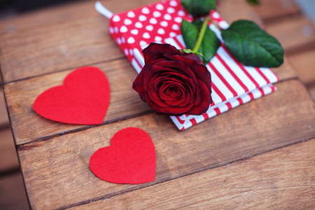 Wooden background with roses and hearts. The concept of greeting and Valentine's Day.の写真素材