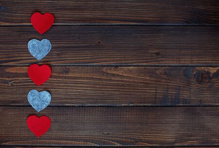 Hearts on a wooden background. The concept of Valentine's Dayの写真素材