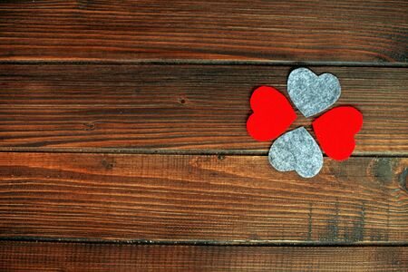 Wooden background with red hearts. The concept of love and Valentine's Day.の写真素材