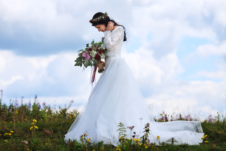 Young beautiful woman in a white dress. The concept of marriageの写真素材