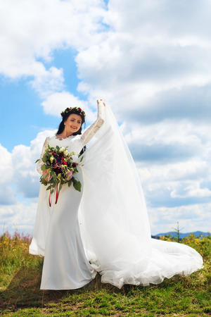 Elegant bride in a white dress. The concept of marriage and lifestyle.の写真素材