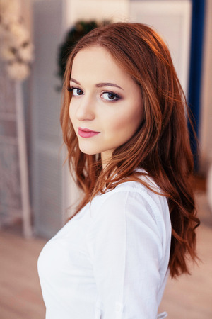 young woman in the room. The concept of lifestyle, fashion, beauty.の写真素材