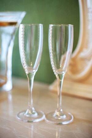 Decorated glasses for alcohol. The concept of wedding and celebration.の写真素材