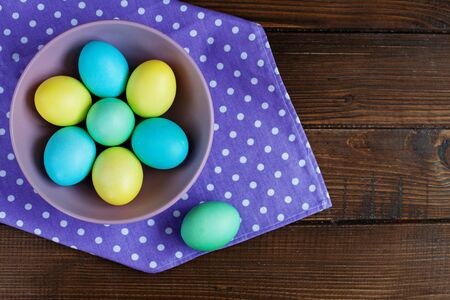 Purple with a bowl of eggs. Top view. Concept Happy Easter.の写真素材