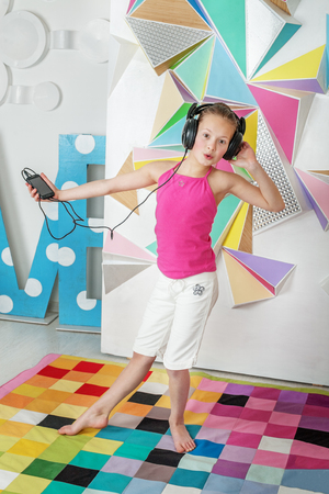 Child girl is singing. The concept of music and childhood.の写真素材