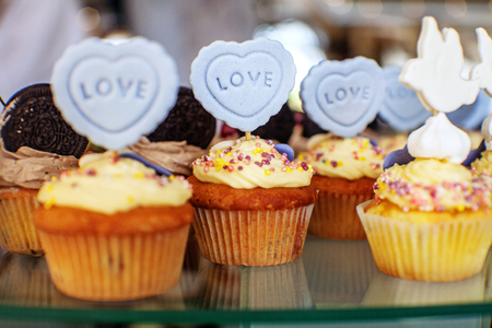 Tasty cupcakes. The inscription is love. The concept of food, party and wedding.の写真素材