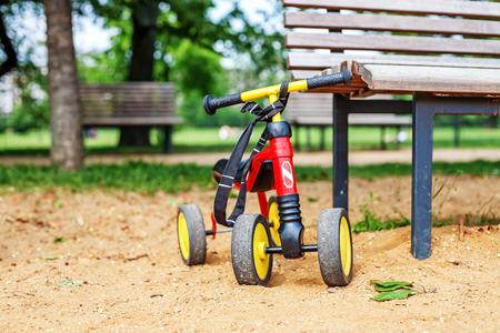 Small children's bike is on the playground. The concept of childhood and lifestyle.の写真素材
