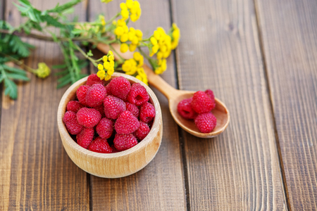 Tasty raspberry. Juicy berry. Summer. Top view. The concept is healthy food, diet, vegetarianism,...