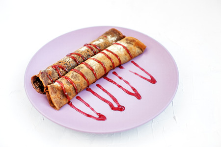 Chocolate pancakes with fruit jam. The concept of food, dessert and vegetarian.の写真素材