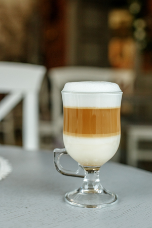 Latte coffee in a glass cup. The concept of hot drinks.の写真素材