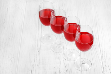 Many glasses of burgundy French wine on a wooden table. Top view.  Concept restaurant, alcohol, party.の写真素材