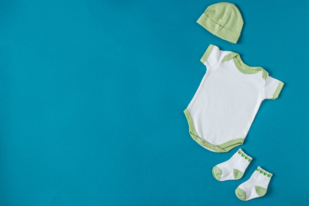 Baby Clothing. Hat and socks. Concept of newborns, motherhood, care, lifestyle.の写真素材