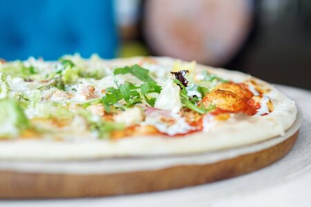 Delicious pizza with cheese and ham. The concept of food, fast food, Italian pizza.の写真素材