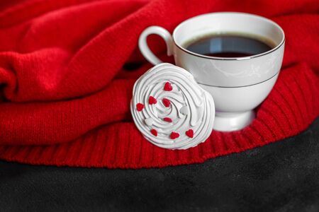 Delicious hot coffee and French meringue with hearts. Concept of drinks, leisure and lifestyle.の写真素材