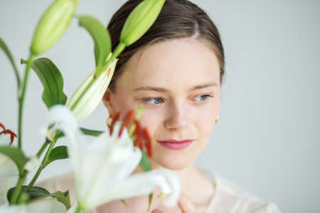 Hair treatment. Fashion model. Romantic background. Pretty young woman. Health care. Clean skin.の写真素材