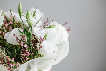 Beautiful bouquet with lisianthus and heather. Place for text. Concept for background, gift, holidayの写真素材