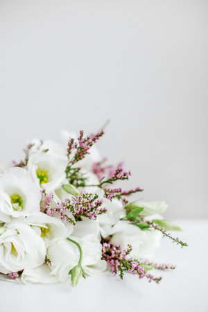 Beautiful bouquet with lisianthus and heather. Place for text. Concept for background, gift, holiday. Verticalの写真素材