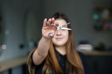 close up shot of beautiful girl hairdresser