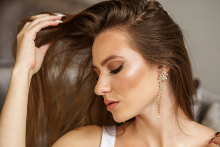 beautiful young woman with long hair and makeup